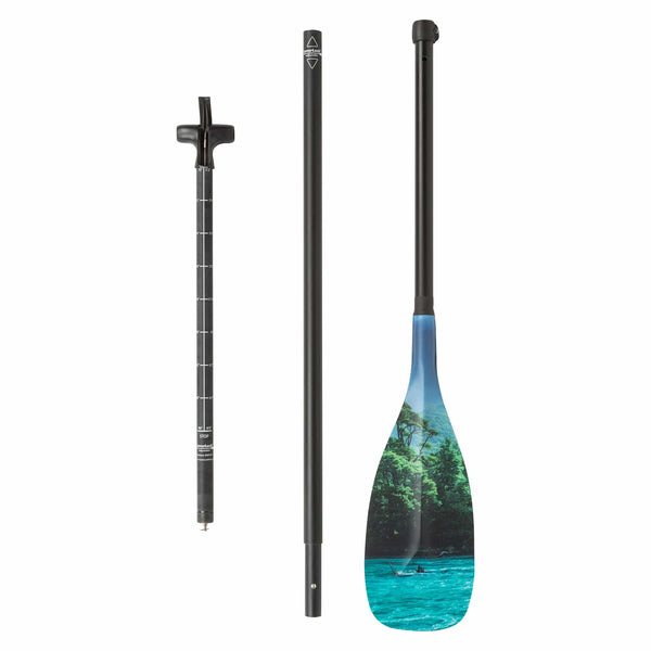 Hala Rival Carbon Paddle shown in its three-piece breakdown form. Features a lightweight black carbon shaft and a vibrant blade with a scenic blue water and forest design—perfect for travel and performance paddling.